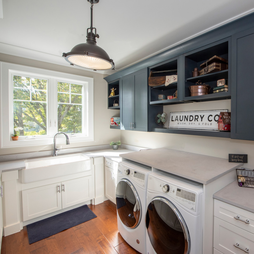 Example of an arts and crafts laundry room design in Other