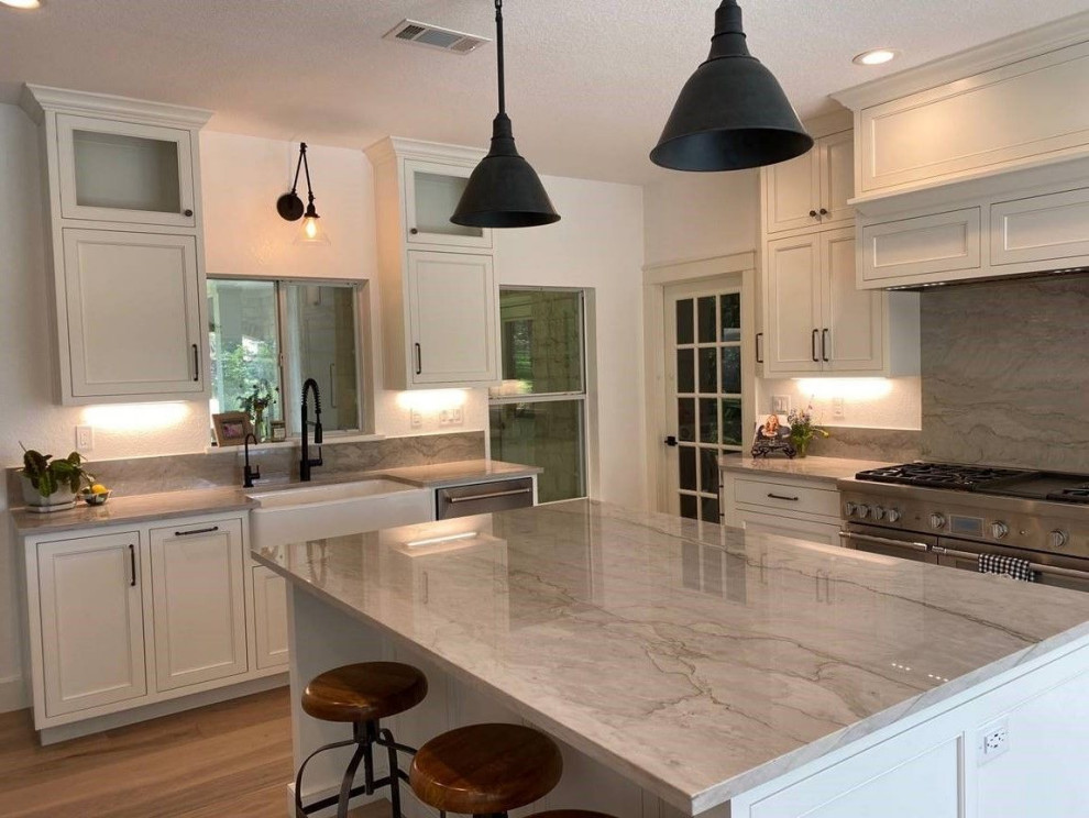Kitchen - large kitchen idea in Miami with quartzite countertops, an island and gray countertops