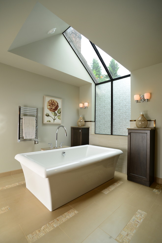 Inspiration for a large contemporary master bathroom in Seattle with shaker cabinets, dark wood cabinets, a freestanding tub, beige tile, an undermount sink, engineered quartz benchtops, an alcove shower, beige walls and porcelain floors.