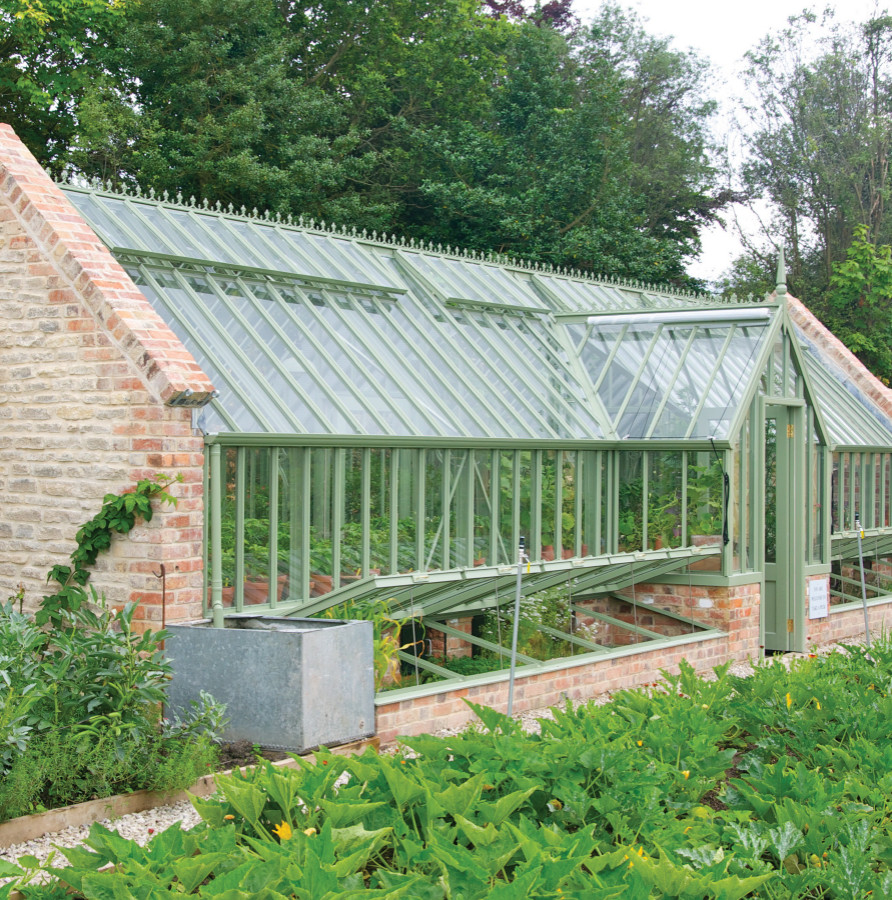 Large traditional attached greenhouse in Dorset.