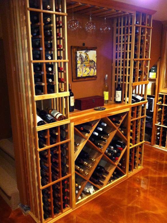 Mid-sized traditional wine cellar in Orange County with storage racks.
