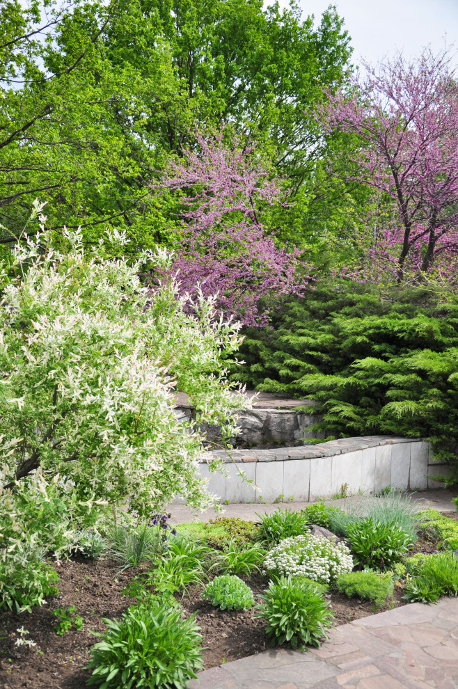 Pollinator garden with native plants and custom stone hardscapes