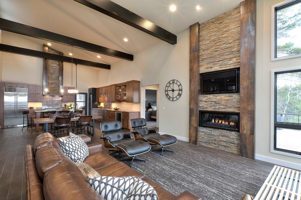 Design ideas for a country formal open concept living room in Other with beige walls, a ribbon fireplace, a stone fireplace surround and a wall-mounted tv.