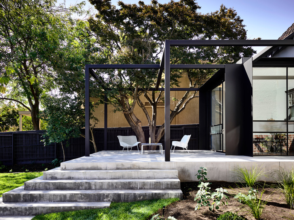 Mid-sized contemporary backyard patio in Melbourne with concrete slab.