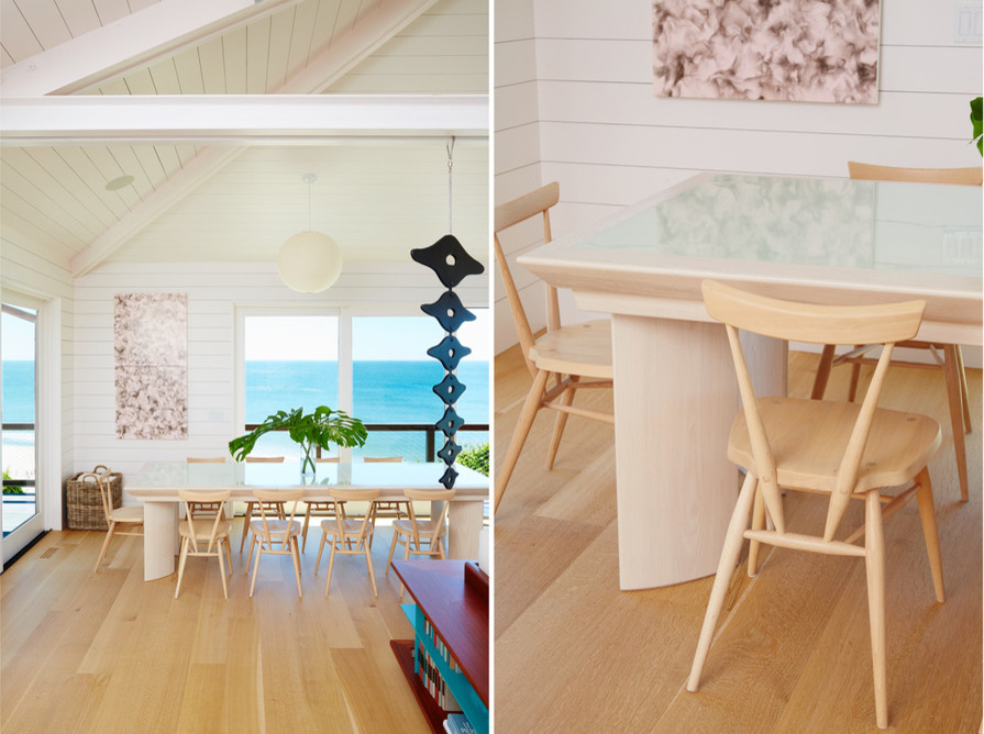 Photo of a beach style open plan dining in New York with white walls and light hardwood floors.