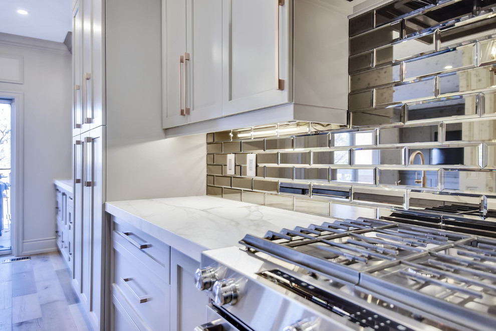 Example of a transitional kitchen design in Toronto