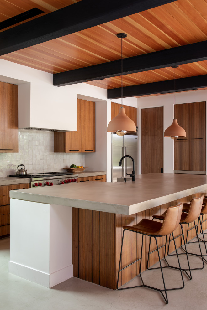 Photo of a contemporary eat-in kitchen in Orange County with a farmhouse sink, flat-panel cabinets, medium wood cabinets, concrete benchtops, multi-coloured splashback, stainless steel appliances, with island, grey benchtop, exposed beam and wood.