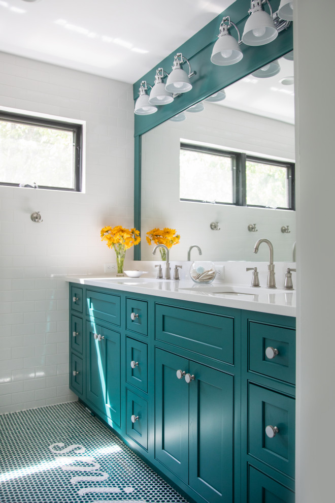This is an example of a transitional bathroom in Milwaukee with beaded inset cabinets, turquoise cabinets, mosaic tile floors, an undermount sink, turquoise floor, white benchtops, a double vanity and a built-in vanity.