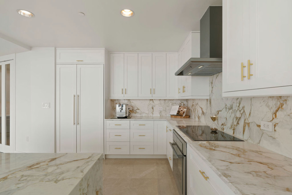Design ideas for a mid-sized contemporary l-shaped open plan kitchen in Tampa with an undermount sink, recessed-panel cabinets, white cabinets, quartz benchtops, multi-coloured splashback, stone slab splashback, white appliances, porcelain floors, with island, beige floor and multi-coloured benchtop.