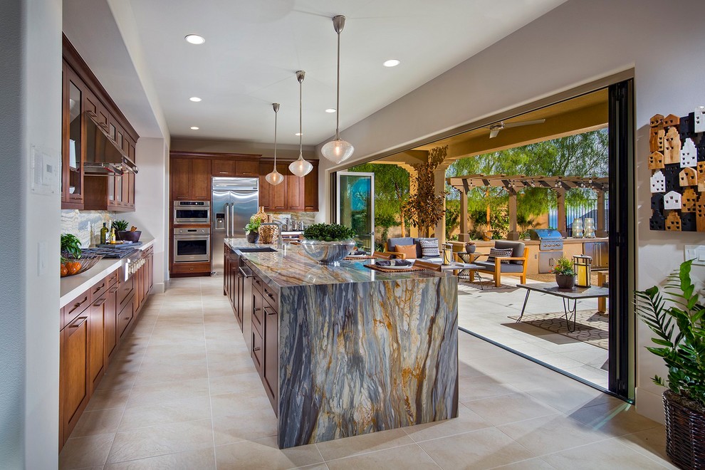 Contemporary l-shaped open plan kitchen in Orange County with shaker cabinets and with island.