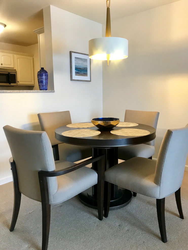Small transitional carpeted and beige floor kitchen/dining room combo photo with beige walls