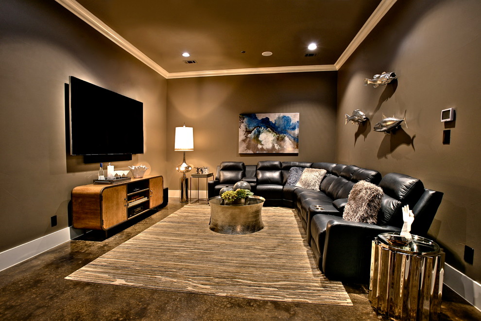 Design ideas for a mid-sized transitional open concept home theatre in Dallas with beige walls, concrete floors and a wall-mounted tv.