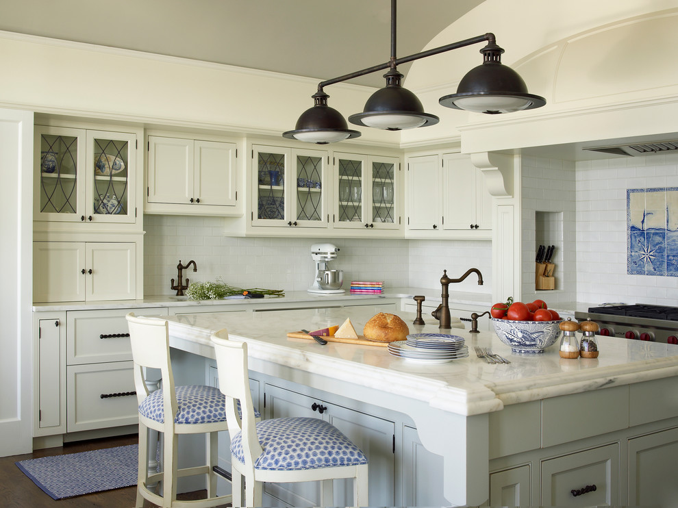 This is an example of a beach style kitchen in New York with beaded inset cabinets and white cabinets.