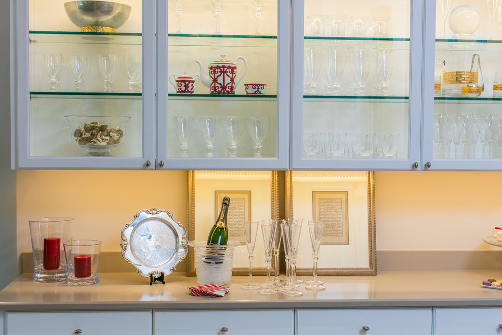 Inspiration for a transitional single-wall eat-in kitchen remodel in Dallas with white cabinets, quartz countertops and beige backsplash
