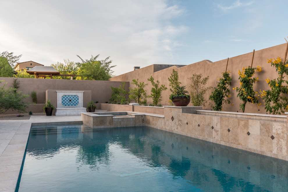 Pool - huge mediterranean two-story stucco beige pool idea in Phoenix with a tile roof