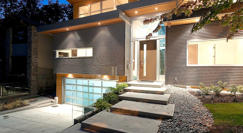 This is an example of a modern exterior in Vancouver with metal siding.