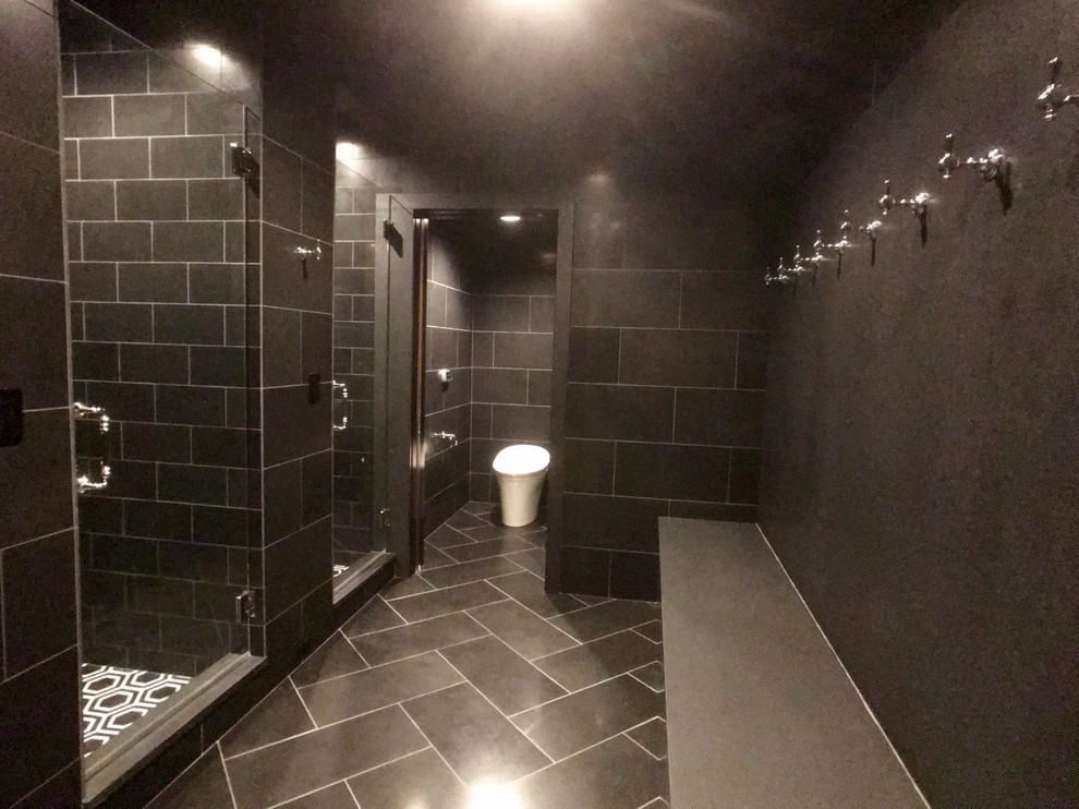 Large traditional bathroom in Milwaukee with a one-piece toilet, white walls, mosaic tile floors, an alcove shower, black and white tile and with a sauna.