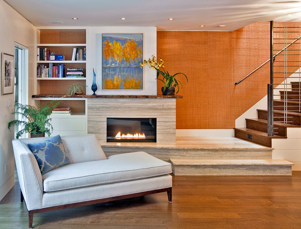 Inspiration for a mid-sized contemporary open concept living room in San Francisco with orange walls, dark hardwood floors, a standard fireplace, a stone fireplace surround and no tv.