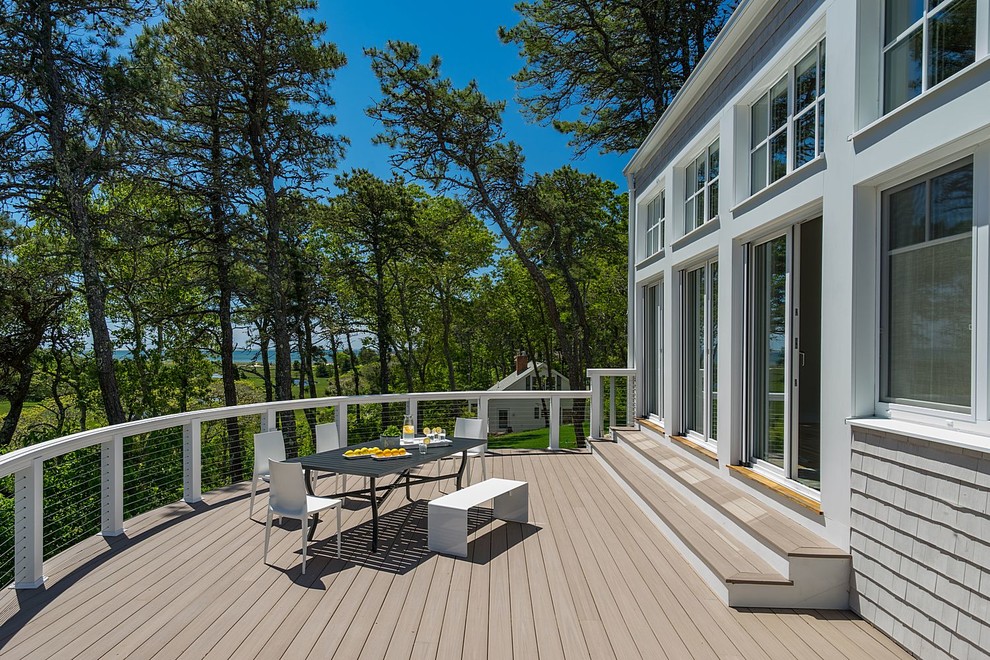 Photo of a large beach style backyard deck in Boston with no cover.