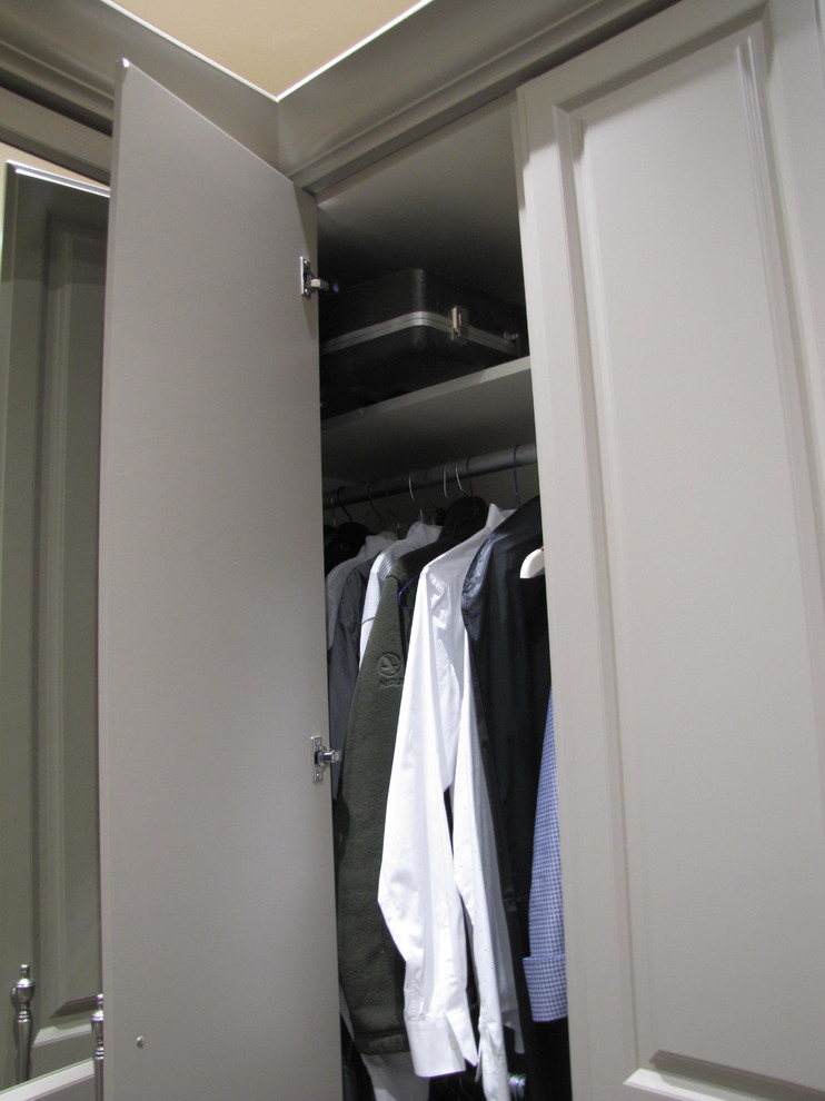 Inspiration for a large traditional men's walk-in wardrobe in San Francisco with raised-panel cabinets, grey cabinets, dark hardwood floors and brown floor.