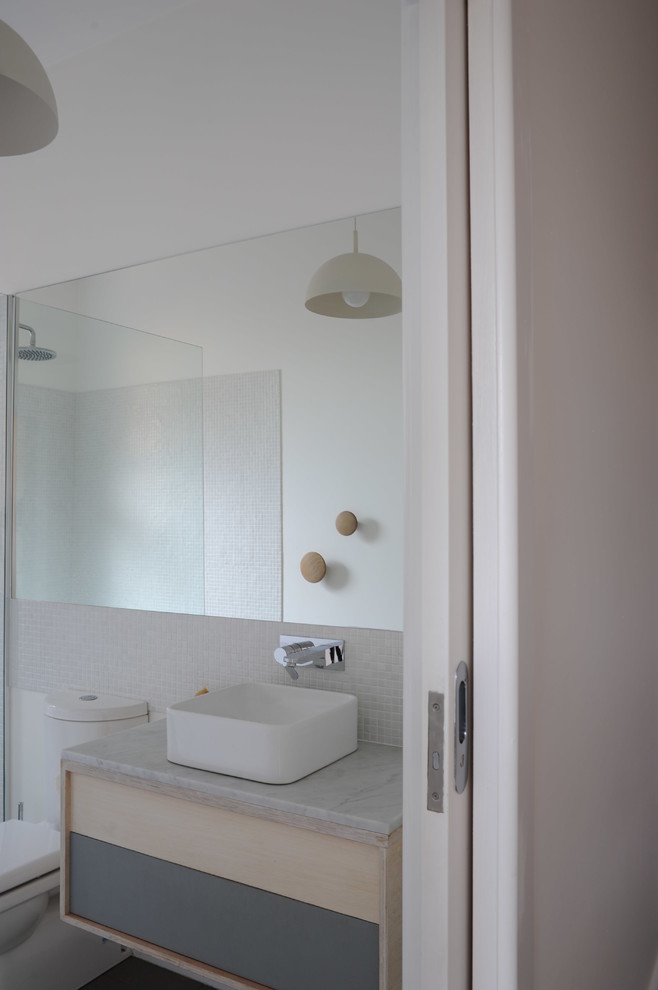 Inspiration for a small contemporary 3/4 bathroom in Melbourne with light wood cabinets, marble benchtops, an open shower, white tile, mosaic tile and white walls.