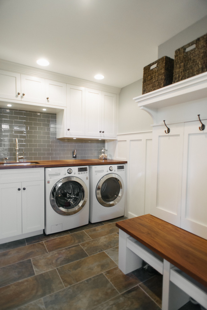 Design ideas for a mid-sized transitional laundry room in Detroit with porcelain floors.