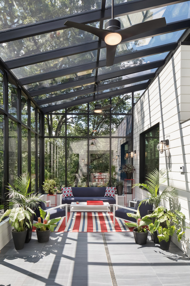 Design ideas for a large modern sunroom in Minneapolis with a glass ceiling and grey floor.