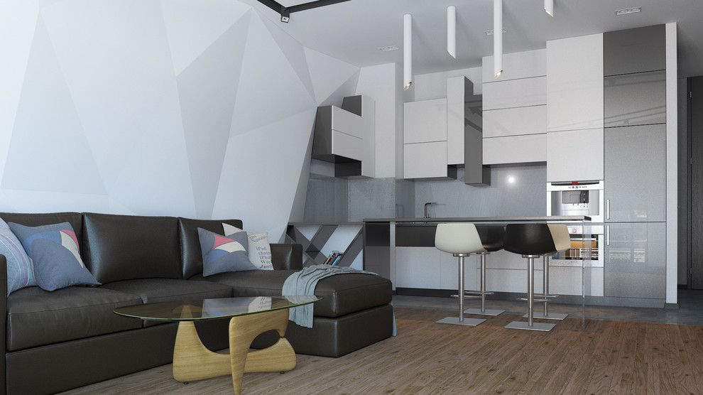 Черно-белый дизайн гостиной, объединенной с кухней