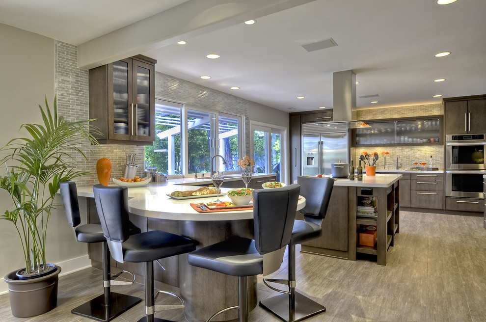 Photo of an expansive contemporary u-shaped kitchen in San Diego with flat-panel cabinets, stainless steel appliances, an undermount sink, grey cabinets, quartz benchtops, white splashback, glass tile splashback, porcelain floors and with island.