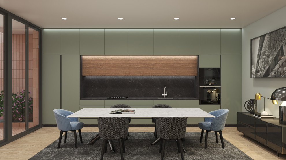 Inspiration for a mid-sized modern single-wall eat-in kitchen in Valencia with an undermount sink, recessed-panel cabinets, green cabinets, marble benchtops, black splashback, marble splashback, black appliances, porcelain floors, no island, brown floor and black benchtop.