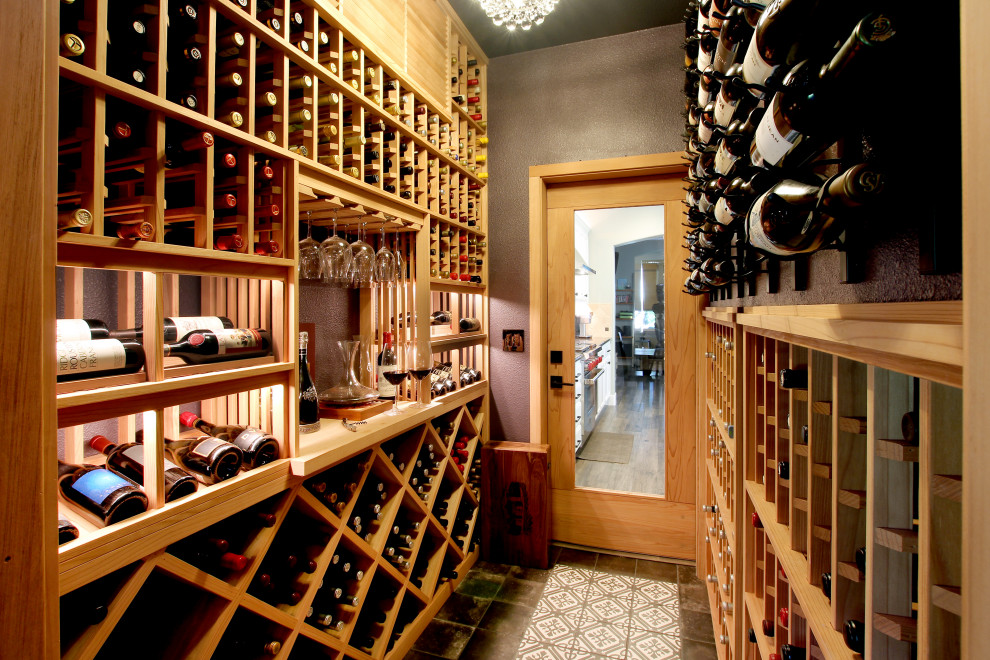 This is an example of a large transitional wine cellar in San Francisco with porcelain floors, display racks and multi-coloured floor.