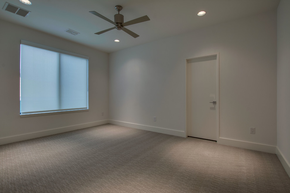 Minimalist light wood floor and brown floor bedroom photo in Dallas with white walls