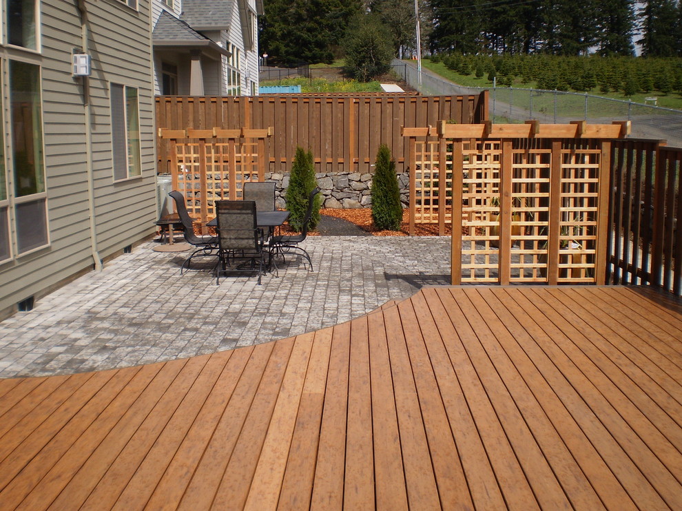 This is an example of a contemporary deck in Portland with no cover.