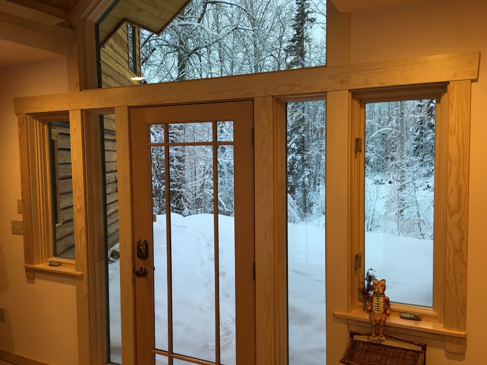 Inspiration for a rustic single front door remodel with white walls