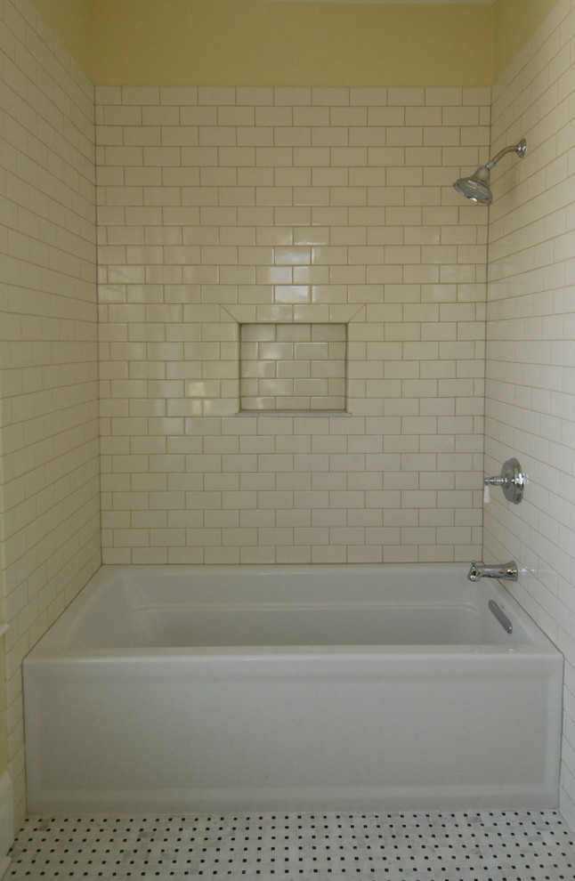 Inspiration for a large traditional master bathroom in Bridgeport with an alcove tub, a shower/bathtub combo, a one-piece toilet, yellow tile, ceramic tile, white walls, marble floors, a pedestal sink, multi-coloured floor and a shower curtain.