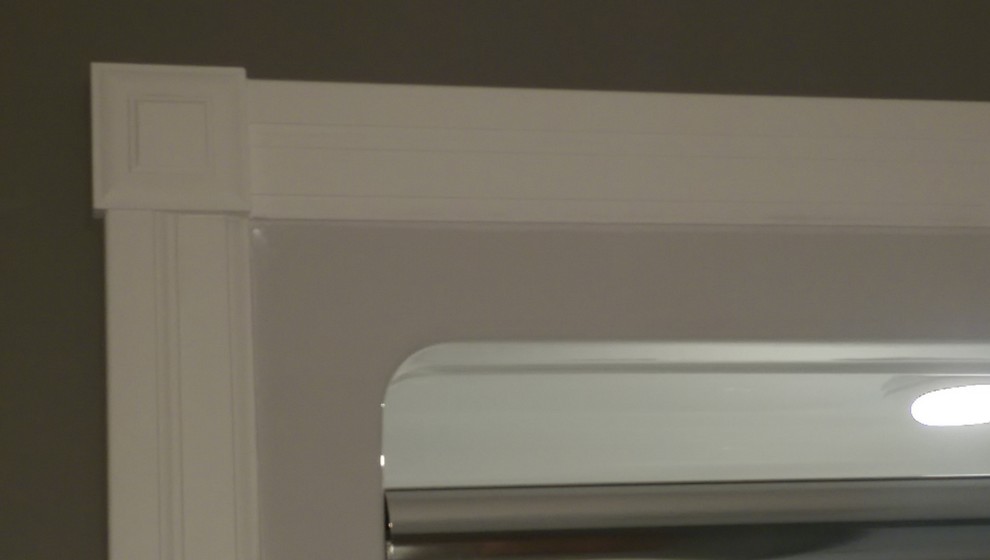 Example of a mid-sized transitional master vinyl floor and multicolored floor alcove bathtub design with recessed-panel cabinets, medium tone wood cabinets, a two-piece toilet, gray walls, laminate countertops and yellow countertops
