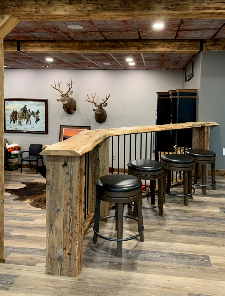 Example of a mountain style home design design in Calgary