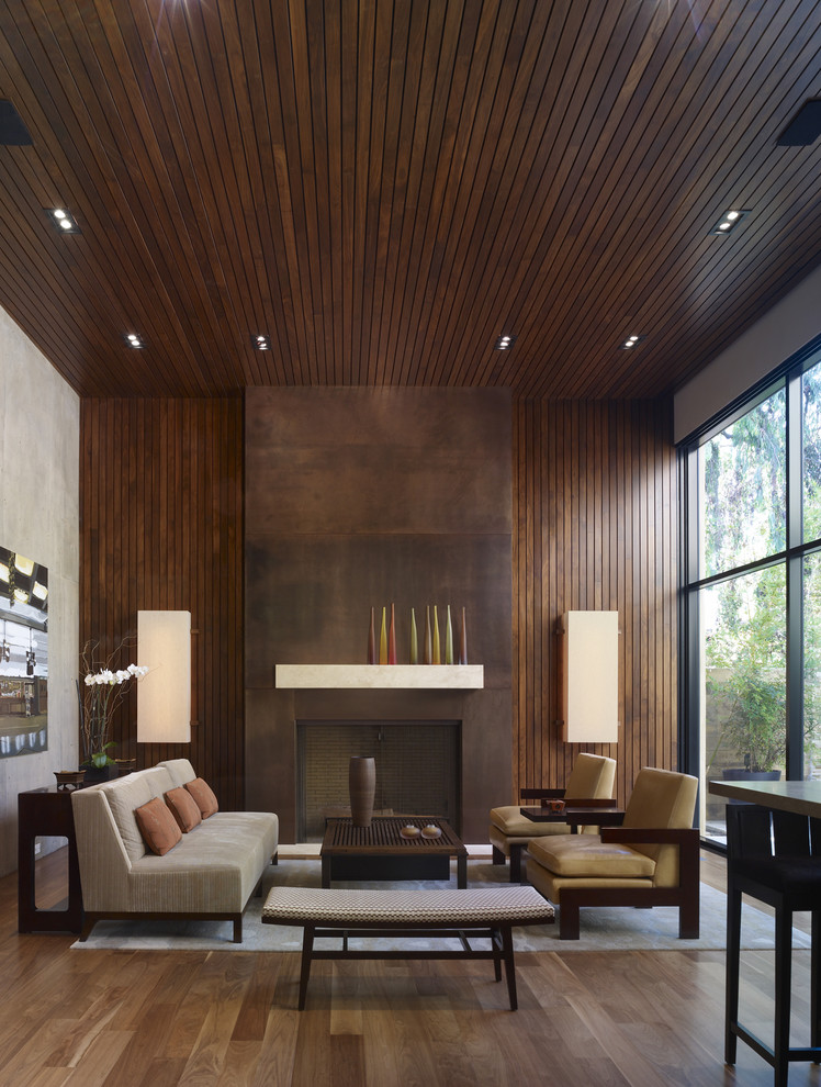 Design ideas for a modern open concept living room in Los Angeles with a standard fireplace.