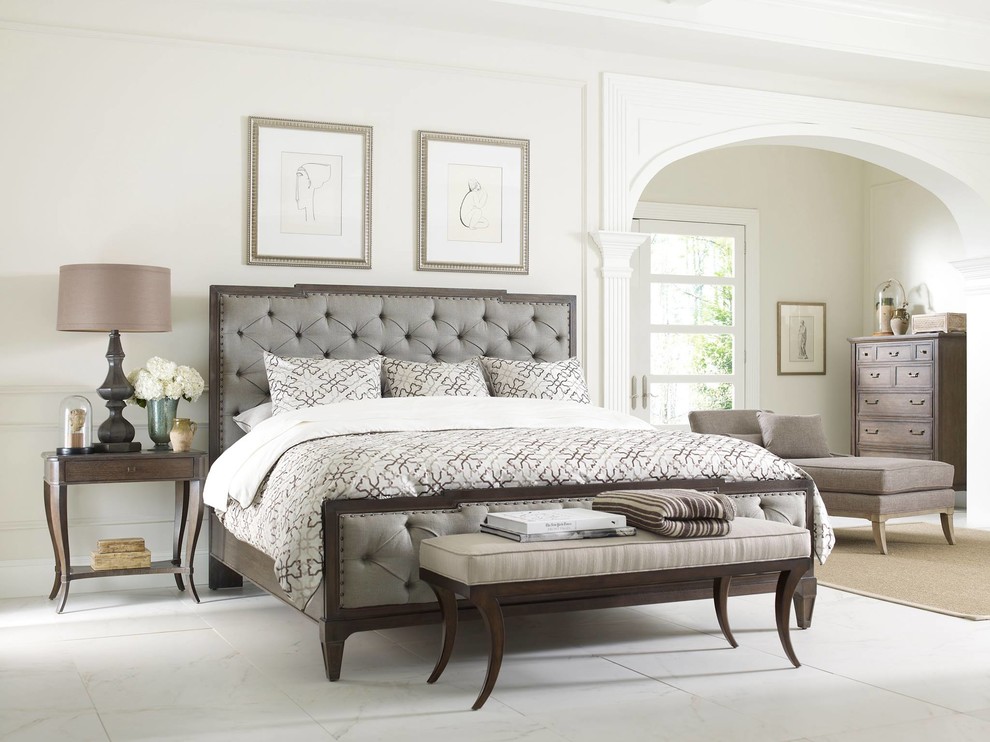 This is an example of a mid-sized bedroom in New York with white walls and ceramic floors.