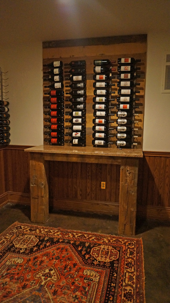 Design ideas for a medium sized classic wine cellar in Philadelphia with concrete flooring and display racks.