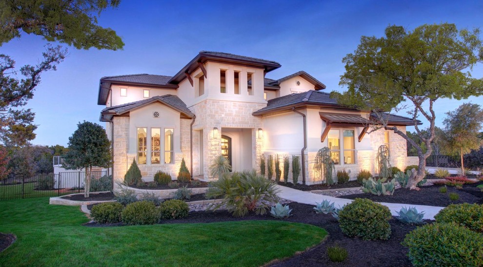 Large transitional beige two-story mixed siding gable roof photo in Austin with a mixed material roof