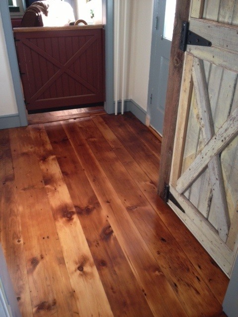 Foyer - mid-sized rustic light wood floor foyer idea in Philadelphia with white walls and a light wood front door
