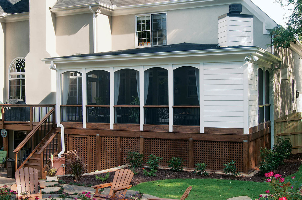 Design ideas for a transitional backyard verandah in Atlanta with a roof extension.