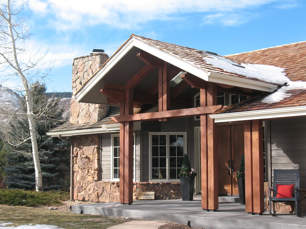 Design ideas for a mid-sized country one-storey grey exterior in Denver with mixed siding and a gable roof.