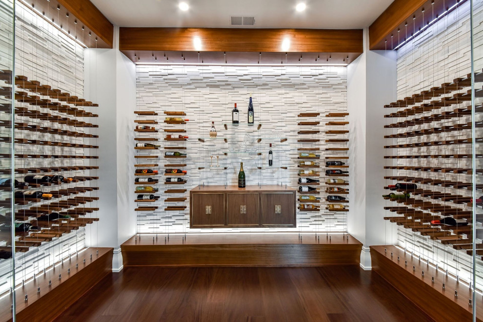 Photo of a contemporary wine cellar in Chicago with medium hardwood floors and storage racks.
