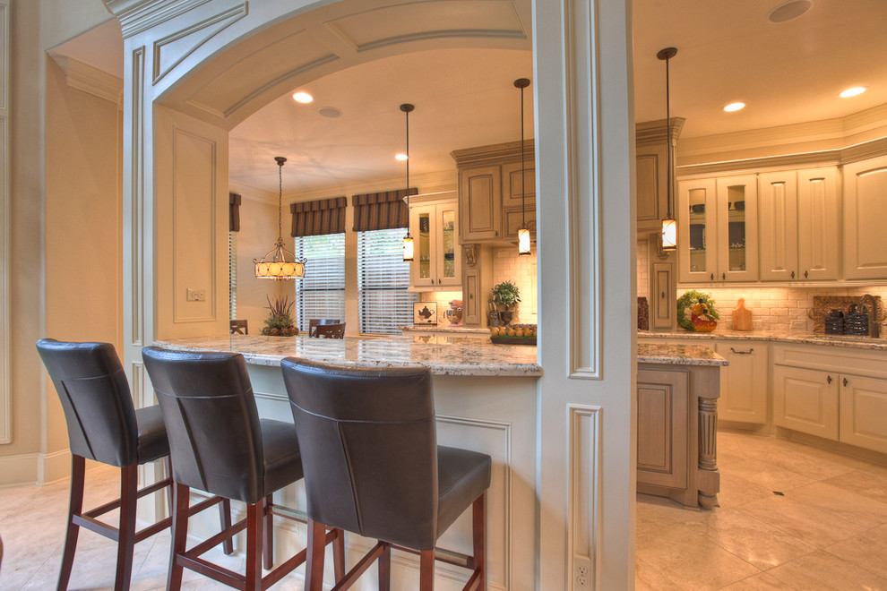 Design ideas for a traditional kitchen in Houston with glass-front cabinets.