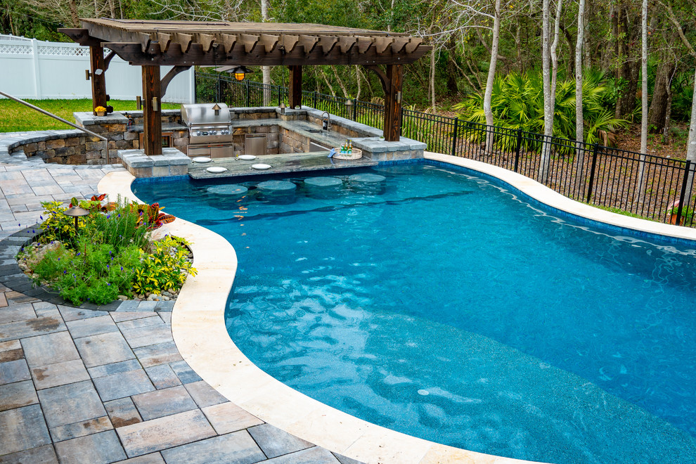 Inspiration for a large traditional pool in Jacksonville.