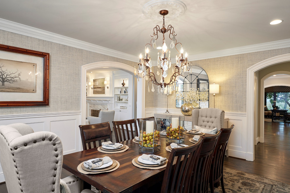 This is an example of a mid-sized transitional open plan dining in Dallas with beige walls, medium hardwood floors, no fireplace and brown floor.