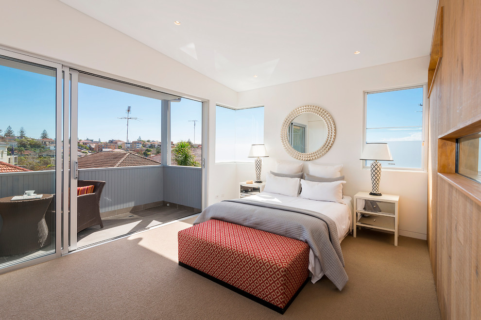 Photo of a mid-sized contemporary master bedroom in Sydney with white walls, carpet and no fireplace.