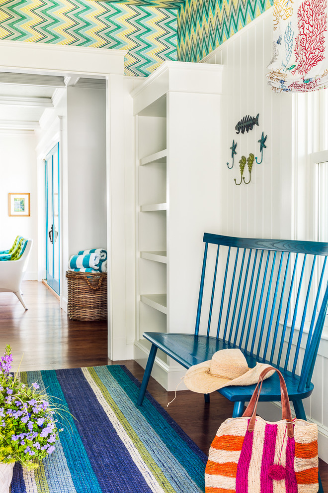 Design ideas for a mid-sized beach style mudroom in Boston with multi-coloured walls and dark hardwood floors.